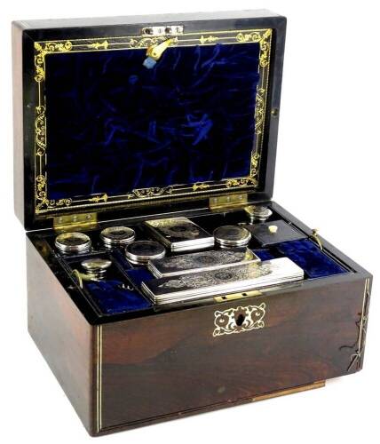 A Victorian rosewood and pewter strung dressing case, the hinged lid inset with a mother of pearl tablet, bearing initials EEB, the fitted interior with various cut glass and silver mounted jars, etc., hallmarked for London 1852, incomplete, the box 30cm