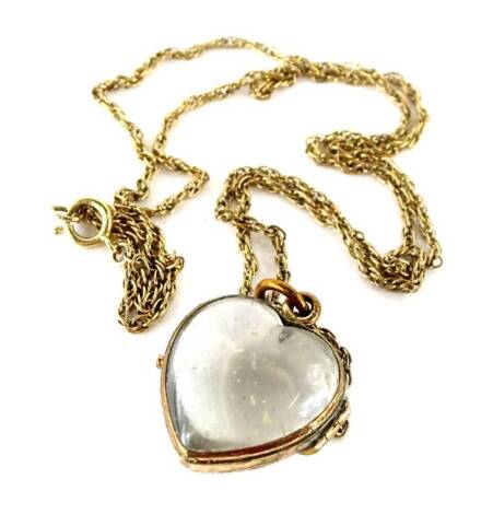 A gold plated and imitation rock crystal pendant, of heart shaped form, on Byzantine chain, the pendant 2cm W, boxed.