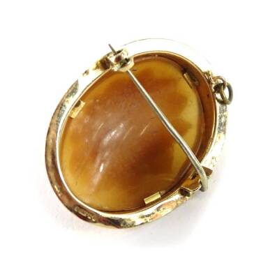 A 9ct gold cameo brooch, the raised cameo with carved rose, in a yellow metal frame, with rope twist borders (AF), 3.5cm x 4.2cm, 7.2g all in. - 2
