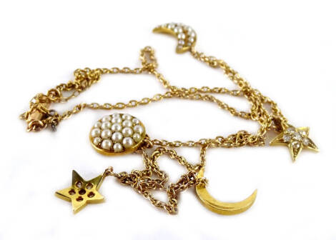 An Eastern style seed pearl set necklace, with five pendants, three set with seed pearls, two crescent moons and sun, and two stars, each set with white paste stones, on fine link chain, with barrel clasp, stamped 15ct, and with additional safety chain, 4