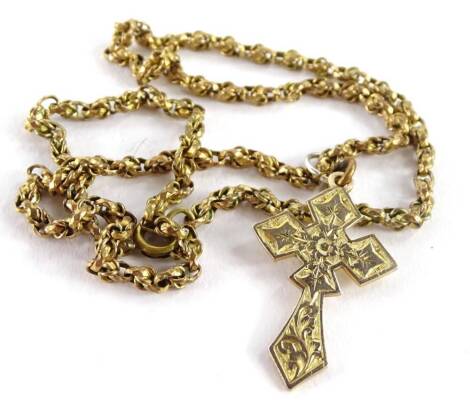 A crucifix pendant, with scroll floral design, 3cm H, yellow metal, unmarked, on a gold plated fancy link chain.