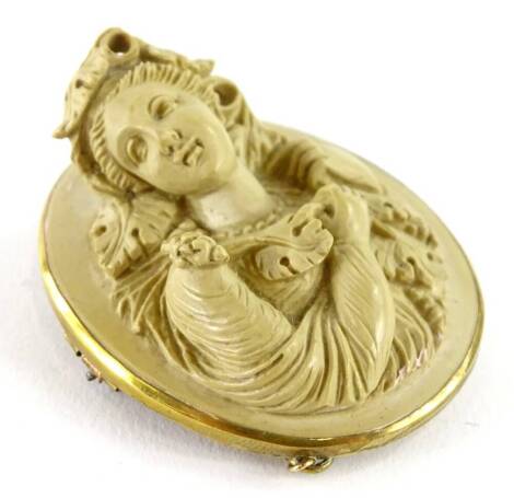 A lava cameo brooch, with raised and carved figure of a lady, in vines, leaves and flowing dress, in a gold plated frame, 4cm x 5cm, boxed.