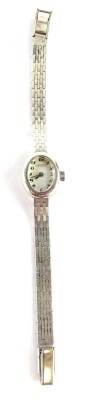 A Nappey silver ladies wristwatch, with small oval dial, on white enamel dial, silver casing on four bar design bracelet, 15cm L overall, 19.7g all in, boxed. - 2