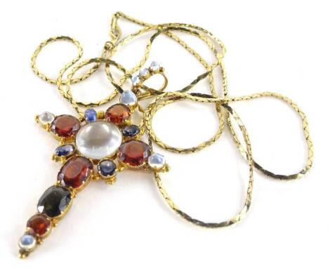 An imitation Victorian style pendant and chain, in the form of a crucifix set with various paste stones, including imitation moonstone, blue and orange coloured stones, in a gilt metal setting, on a gold plated chain, the pendant unmarked, 7.5cm H.