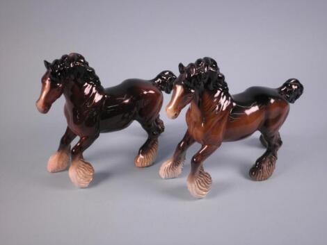 Two Beswick galloping Shire Horses in brown