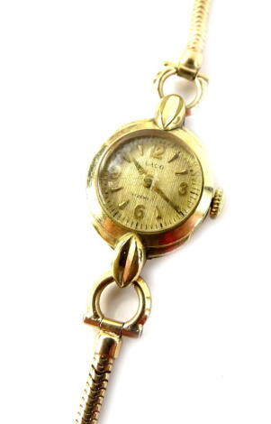 A Laco ladies wristwatch, with small circular dial, and rope twist design bracelet, the watch head gold plated, on 9ct gold strap.