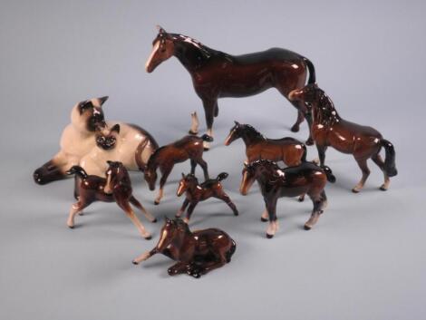 A Beswick foal, various other Beswick horses and two Siamese