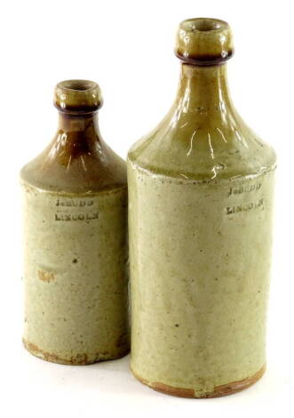 Two 19thC Lincolnshire stoneware bottles, each stamped J Budd of Lincoln.