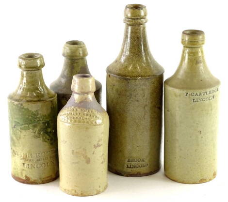 Five Lincoln related stoneware bottles, stamped John Sane, Veterinary Surgeon Lincoln, P Cartridge, Barratt, Leversedge and Brook. (AF)