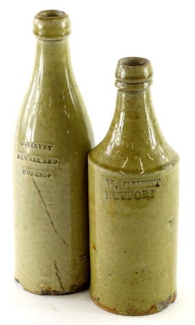 Two Nottinghamshire related 19thC stoneware bottles, stamped G Harvey Newark and Worksop, and H Guest Retford.