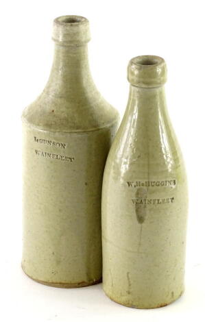 Two Wainfleet related stoneware bottles, stamped I Gonson and W H Huggins. (AF)