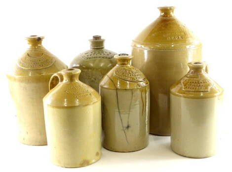 A collection of stoneware bottles, stamped W.Rainey Spilsby, Welbourn Brothers of Lincoln (2), John Weighhill and Sons (late Clarkson and Weighhill Whitby, etc)