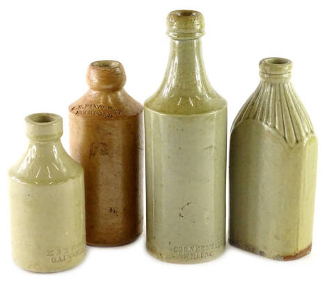 Four stoneware bottles, stamped H and E Forest of Gainsborough, G.E.Fancourt Stamford, and an unmarked slab shaped bottle, etc.