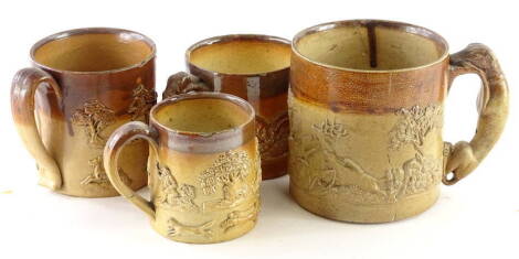 Four 19thC stoneware cups, each with sprigged decoration of hunting scenes, etc. (AF)