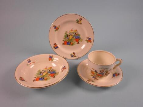 A child's ceramic christening set comprising cup