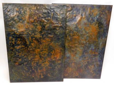 A pair of African hammered bronze panels, in plain frames, wooden backing, 121cm x 86cm.