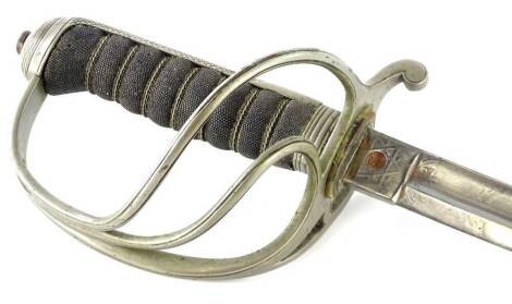 An 1857 pattern British artillery officer's dress sword, with steel scabbard, the engraved blade stamped 7488, and with a pierced guard and shagreen handle, 105cm L.