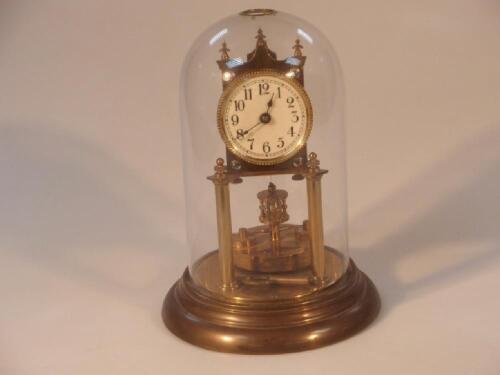 A German gilt brass anniversary torsion clock