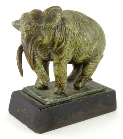 An early 20thC cold painted spelter figure of an elephant, in the manner of Bergman, on an iron base, 9cm W.