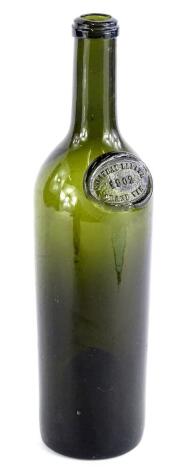 An early 20thC French green glass bottle, with label for Chateau Lafite 1902, Grand Vin, 30cm H.