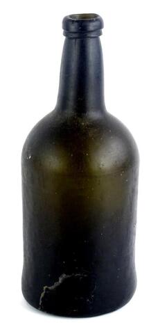 An 18thC green glass bottle, (AF), 24cm H.