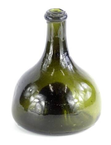 A 19thC onion shaped green glass bottle, 19cm H.