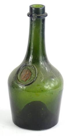 A 19thC green glass bottles, with circular recess containing a red wax seal, 28cm H.