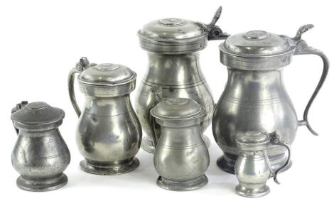 Six 19thC baluster shaped pewter imperial lidded measures, ranging from four gills down to one gill.