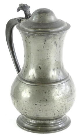 An 18thC baluster shaped pewter lidded tankard, with engraved thumb piece and domed cover, the body engraved Alexander Frazer Lord Lovat 1740, 29cm H.