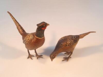 A pair of 20thC cold painted bronze models of pheasants