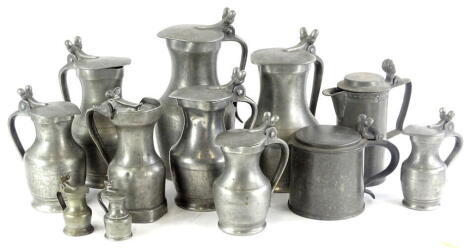 Miscellaneous continental pewter lidded flagons, each with acorn thumb pieces, etc.