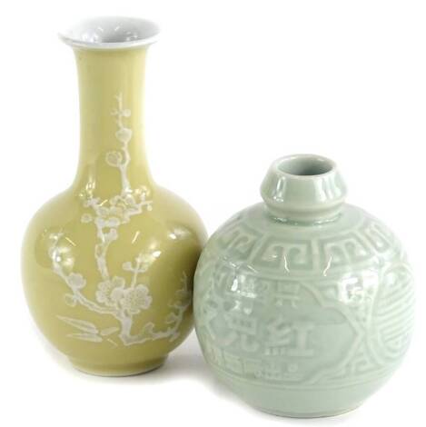 A Chinese celadon globular vase, decorated with geometrical devices, signed to underside, and a cafe au lait ground Chinese bottle vase, decorated with prunus. (2)