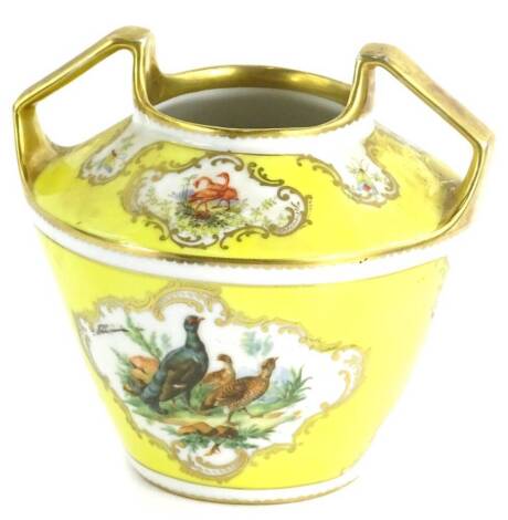 A yellow ground porcelain vase, with two handles and reserves of game in the manner of Helena Wolfsohn, 16cm H.