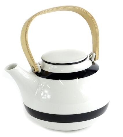 A Kahler porcelain teapot, with bentwood handle, 20cm W.