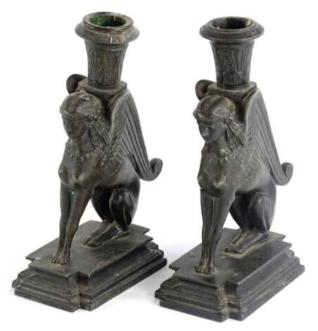 A pair of 19thC bronze chambersticks, cast in the form of Sphynx, 18cm H.