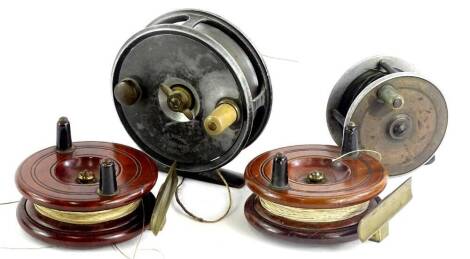 Four various fishing reels, to include an example stamped Victoria Street in aluminium and brass, etc., another similar and two mahogany and brass mounted small reels.