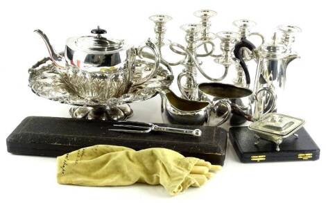 Miscellaneous silver plate, to include a basket with swing handle, three piece oval teaset, candelabra, etc.