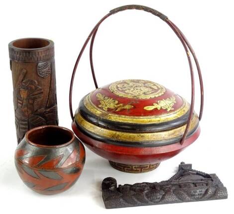 Miscellenous oriental items, to include a carved bamboo cylindrical vase, a panel carved with buildings, etc., probably colonial, a lacquer food container and an African vase, decorated in terracotta and black.