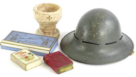 Miscellaneous items, to include a grey painted military type helmet, a small carved marble font, playing cards and various postcards, etc.