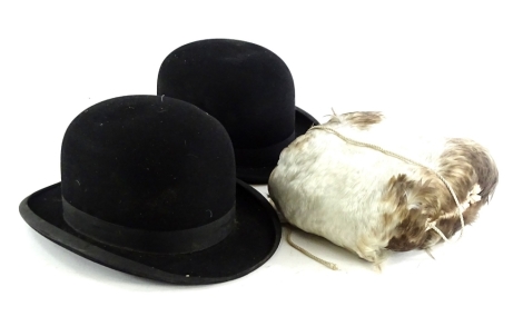 Two gentlemens' bowler hats, labels for Unitas and Hope Brothers and a feather muff.