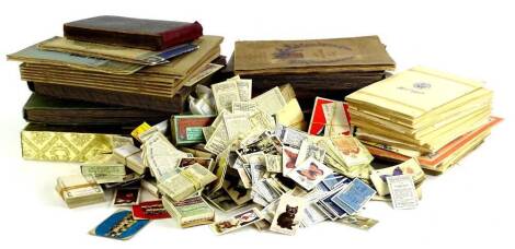 A large quantity of cigarette cards, trade cards, etc.