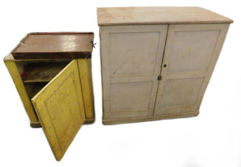 A 19thC pine two door cupboard painted cream, (AF), a similar cupboard painted yellow and a 19thC mahogany bed tray. (AF)