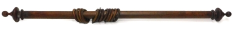 A Victorian stained wooden curtain pole and curtain rings, 171cm L.