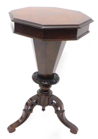 A Victorian figured walnut trumped shaped work table, the octagonal hinged top enclosing a fitted interior on pierced tripod base, 74cm H, 47cm W.