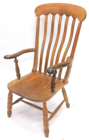 A 19thC lath back Windsor armchair, with shaped supports, solid seat and turned legs with H stretcher.