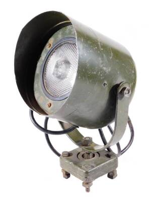 A early 20thC American Sturdilite industrial light, in green, with circular casing and frosted glass front, on adjustable stem and square base, painted green, label to the back, 41cm H.