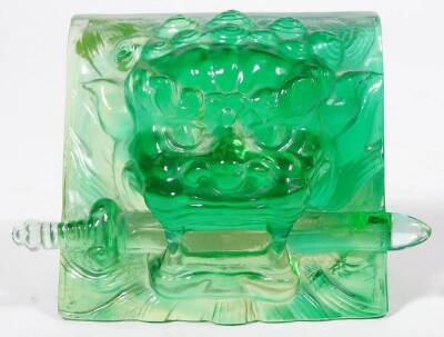 A jade coloured glass sculpture paperweight, of a lion's head with sword to the mouth, possibly Sri Lankan, 12cm W. Provenance: Gifted to the vendor by then Prime Minister Margaret Thatcher. - 2