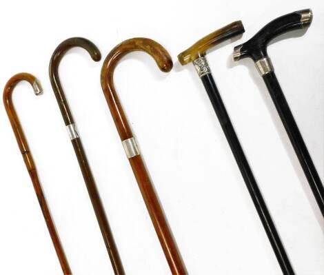 Various walking sticks, canes, etc., some with silver collars. (a quantity, various dimensions, marks and dates)