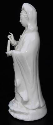 A Chinese blanc de chine porcelain figure, of a lady standing in flowing robes holding candle, on a shaped base (hollow), 15cm H. - 2