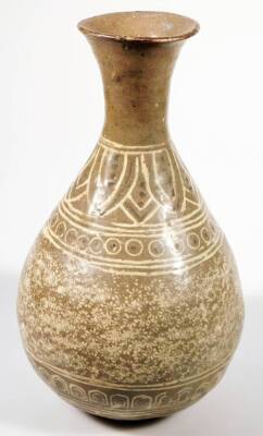 A Korean type pottery Buncheong design vase, stamped with a repeat floral pattern with an upper flower and orb decoration, on circular foot, glazed in cream and brown, 23cm H. - 2